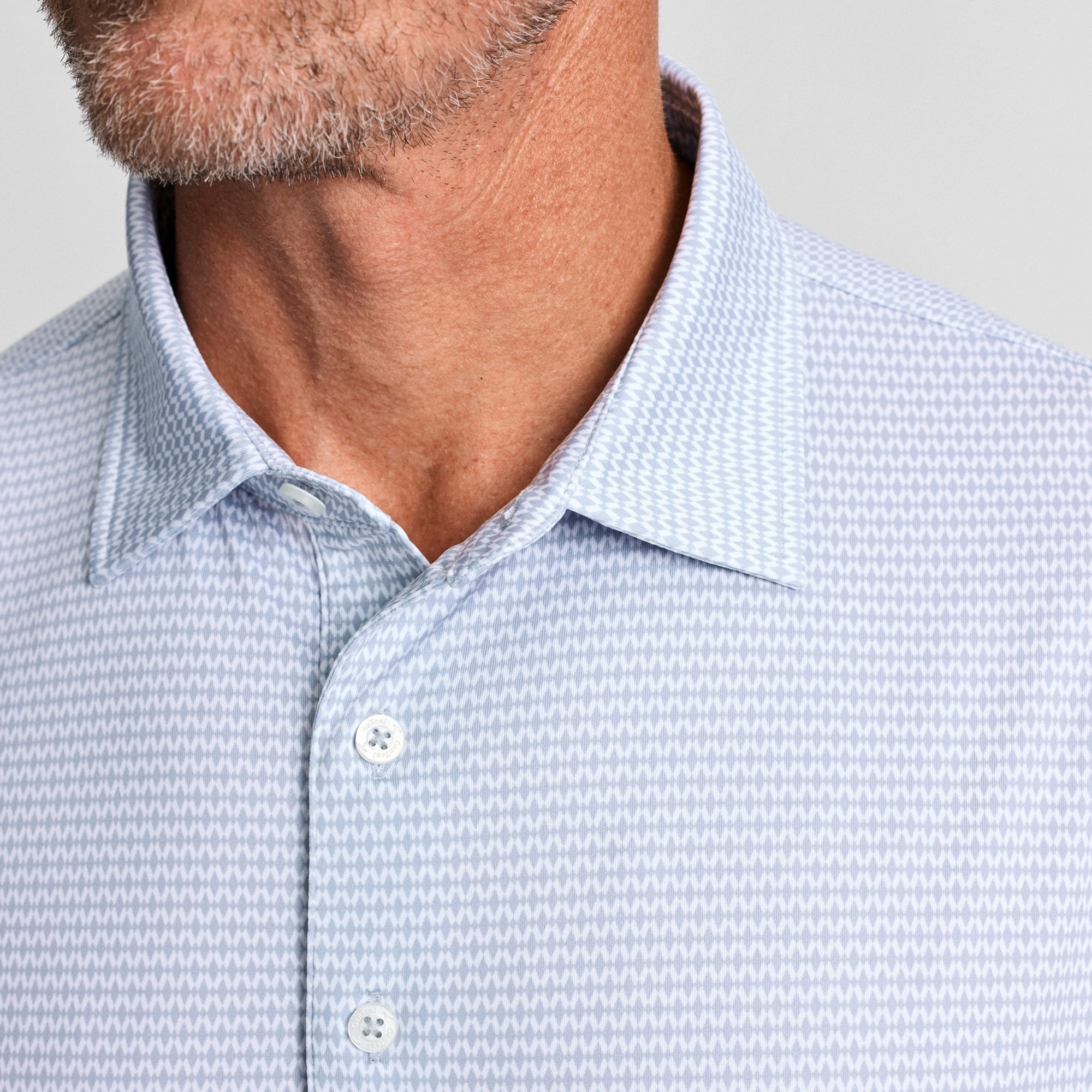 Dimensional Stability Weave Argyle Geo Printed Performance Polo