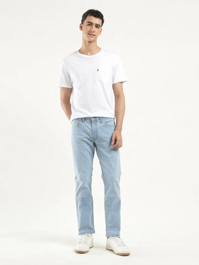 Men's 511 Indigo Slim Fit Mid Rise Jeans Elegant Travel Outfit Minimalist Style Distressed Details